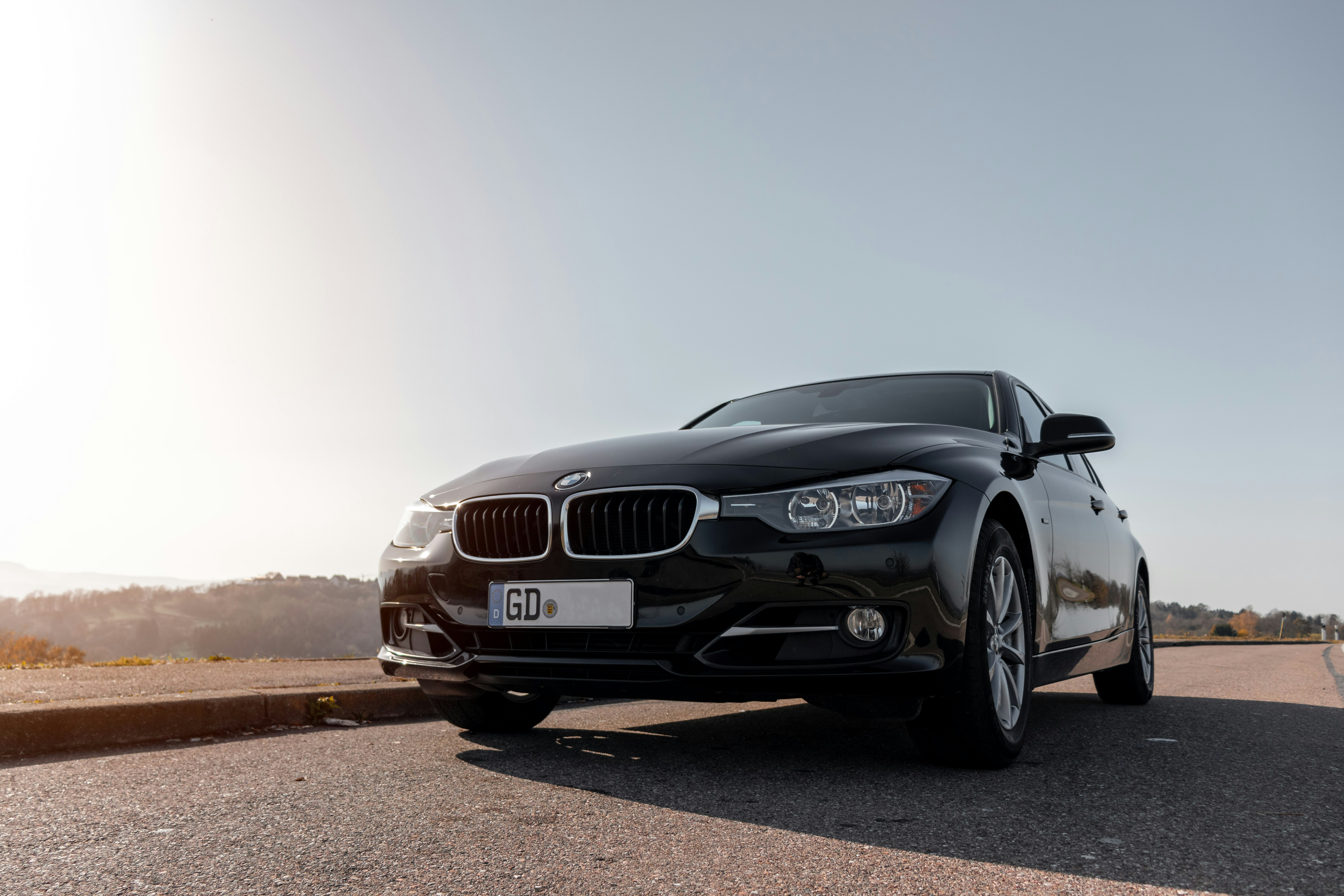 black bmw m 3 on brown dirt road