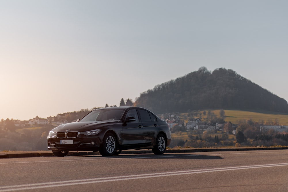 black suv on road during daytime