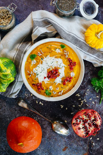 Creamy roasted pumpkin soup in a white ceramic bowl