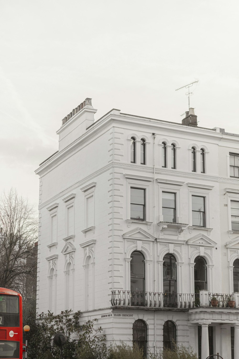 white concrete building near bare trees during daytime