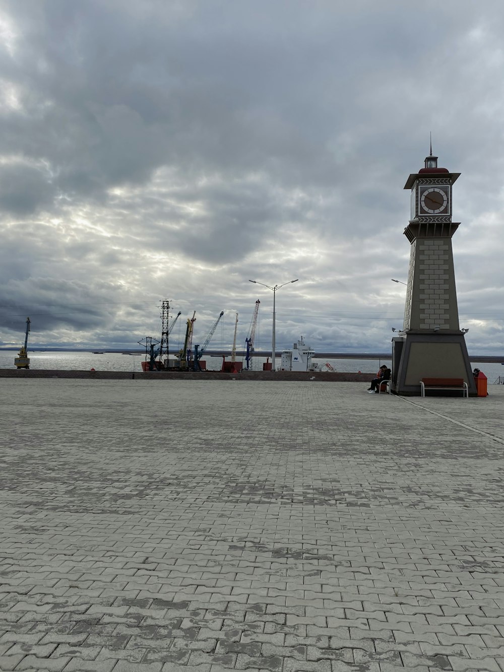 white and brown lighthouse near body of water during daytime