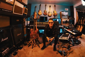 man in black jacket sitting on chair beside woman in black long sleeve shirt