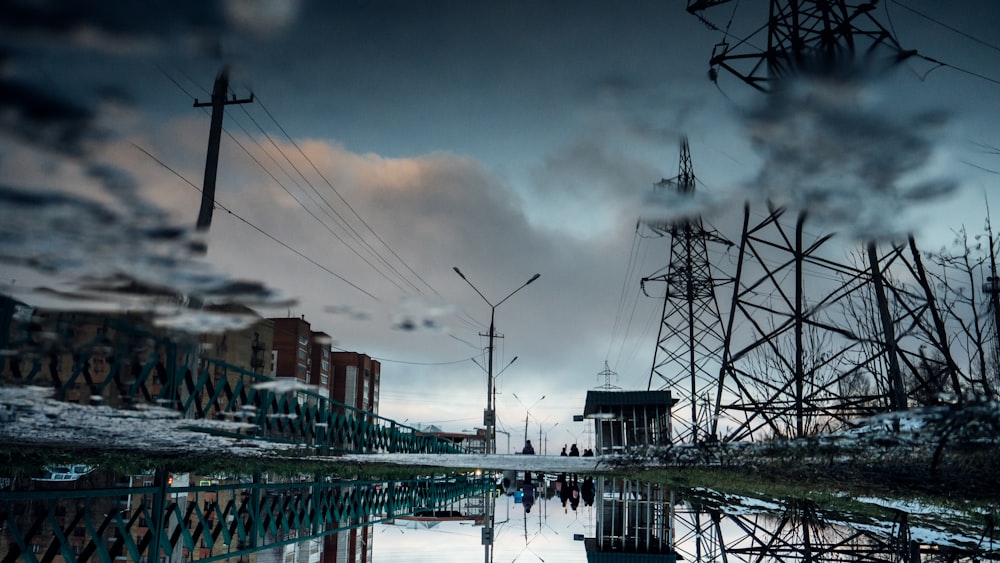 white and black metal bridge over river