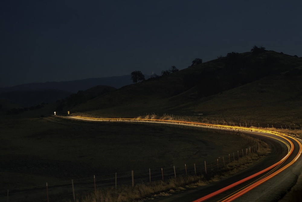 time lapse photography of road during night time