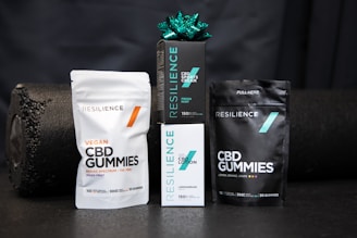 a package of cbd gummies next to a bag of cbd gummies