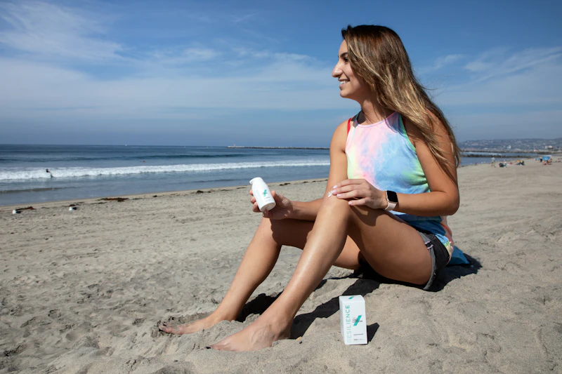 Person sitting on a sunny beach