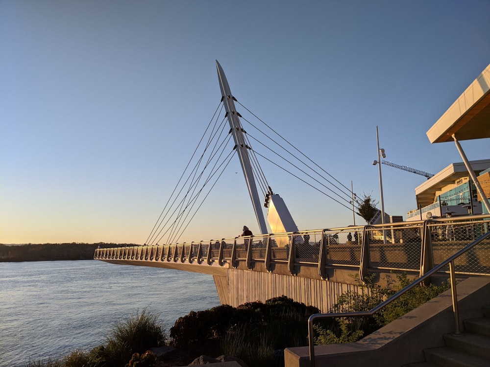 brown bridge over body of water during daytime