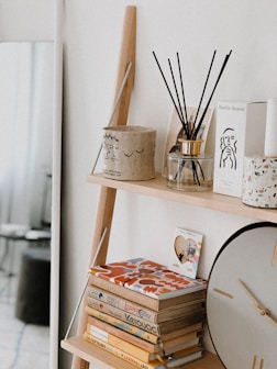 brown wooden table decor on white wooden shelf