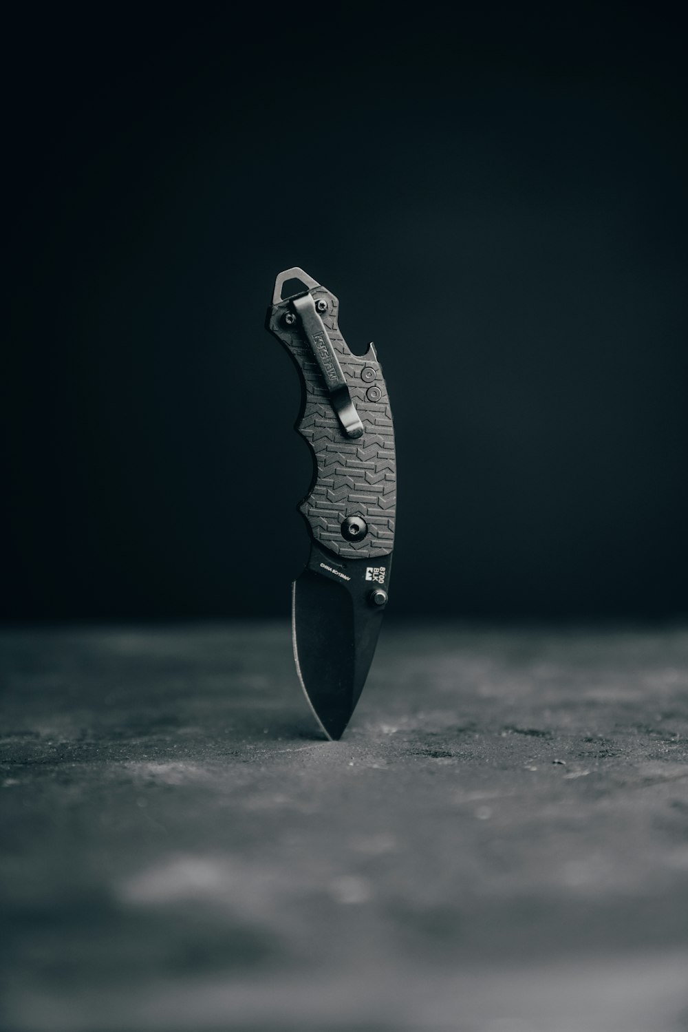 black and silver folding knife