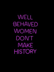 Neon pink text on a black background conveying a powerful message about the impact of behavior on making history.