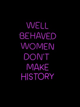 Neon pink text on a black background conveying a powerful message about the impact of behavior on making history.