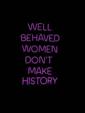 Neon pink text on a black background conveying a powerful message about the impact of behavior on making history.