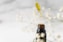 clear glass bottle with yellow lid