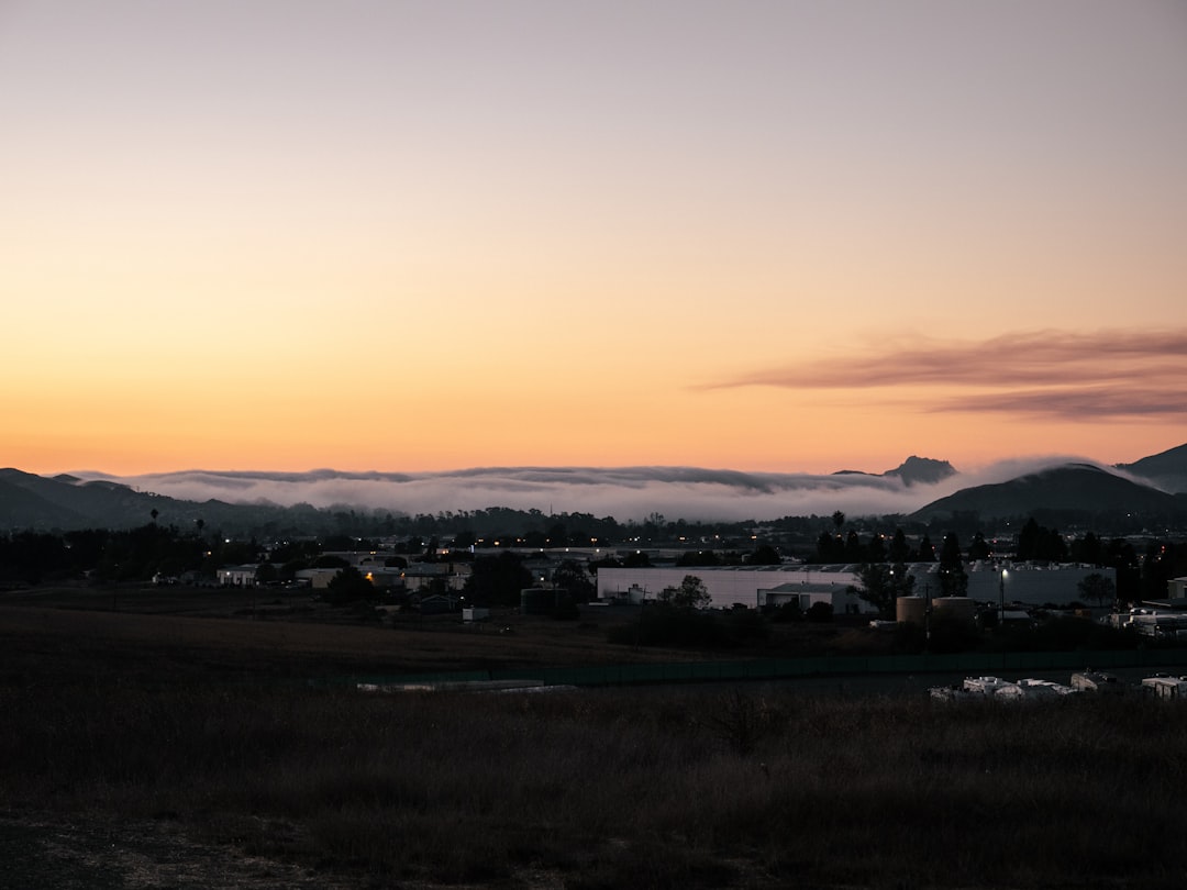 silhouette of houses during sunset