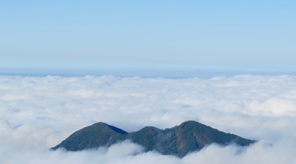 mountains covered with clouds during daytime