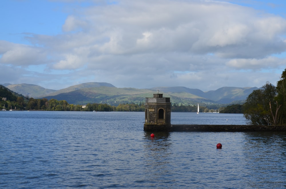 brown wooden dock on body of water during daytime