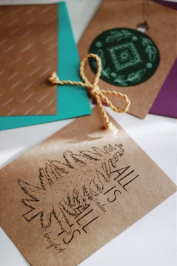 A collection of beautifully crafted handmade cards displayed on a rustic wooden table.
