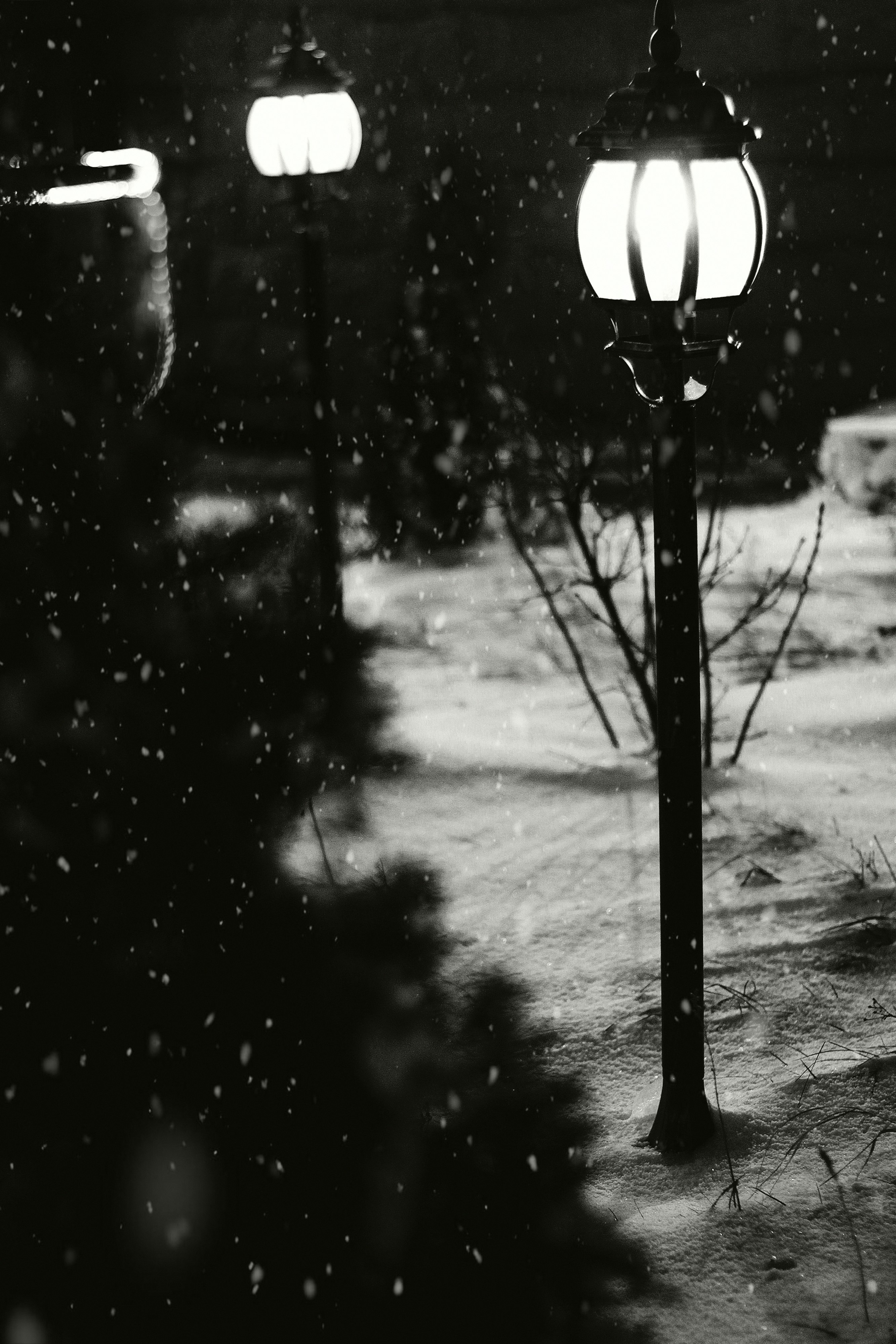 black street light during snow