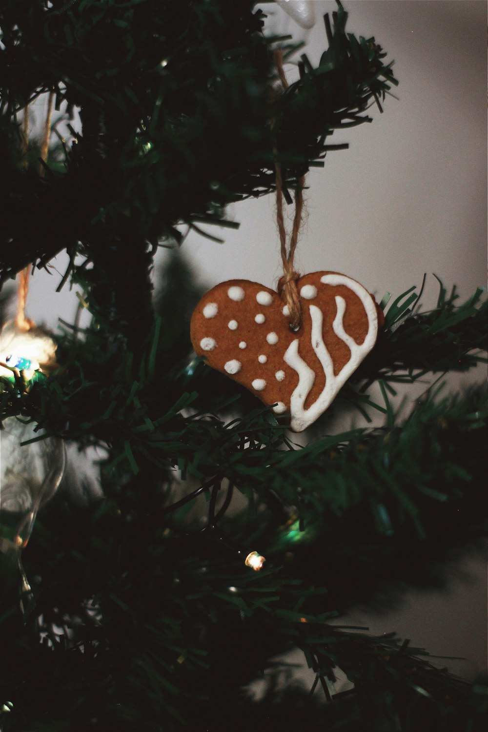 green christmas tree with white and brown polka dot ornament