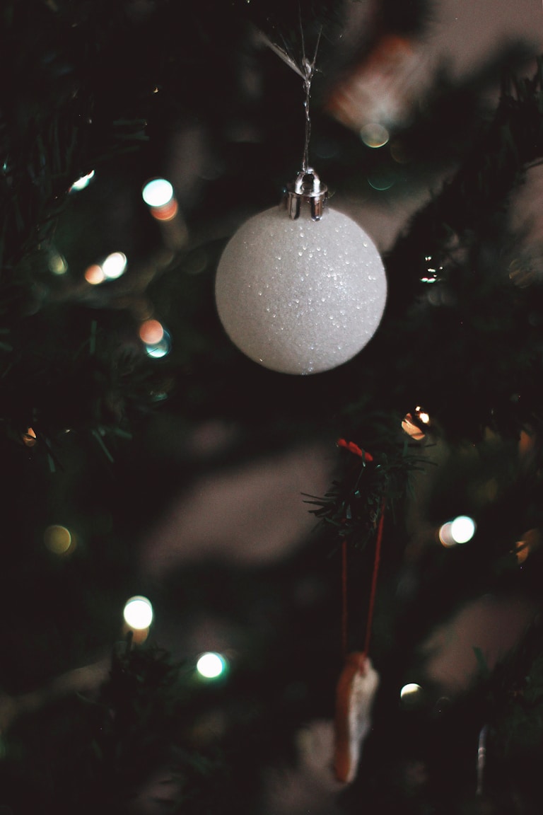 white christmas bauble on christmas tree