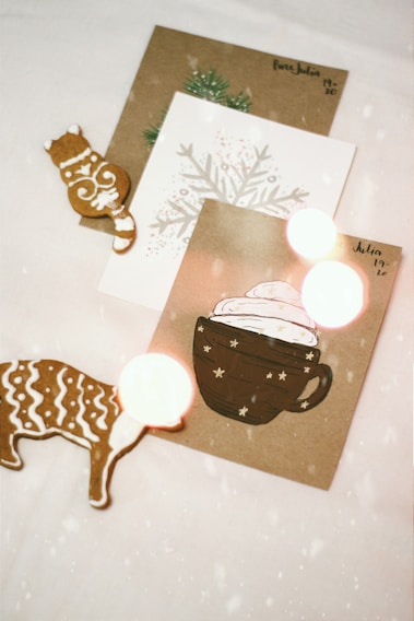 A beautifully designed Christmas card featuring two mice celebrating the holiday season.