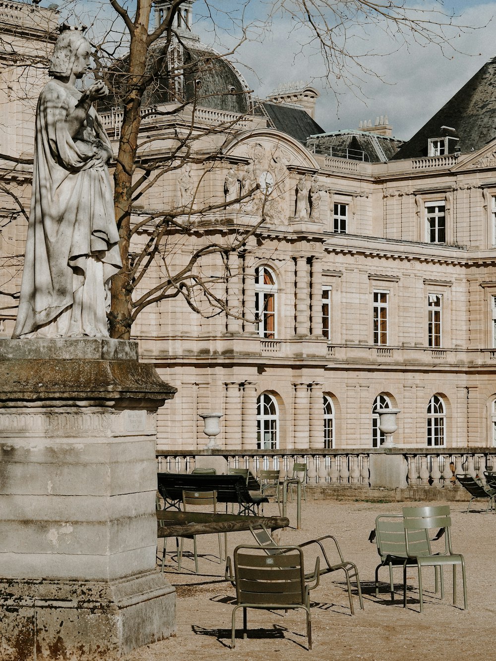 white concrete building with statue