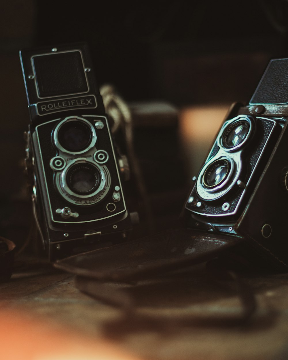 black and silver camera on brown wooden table