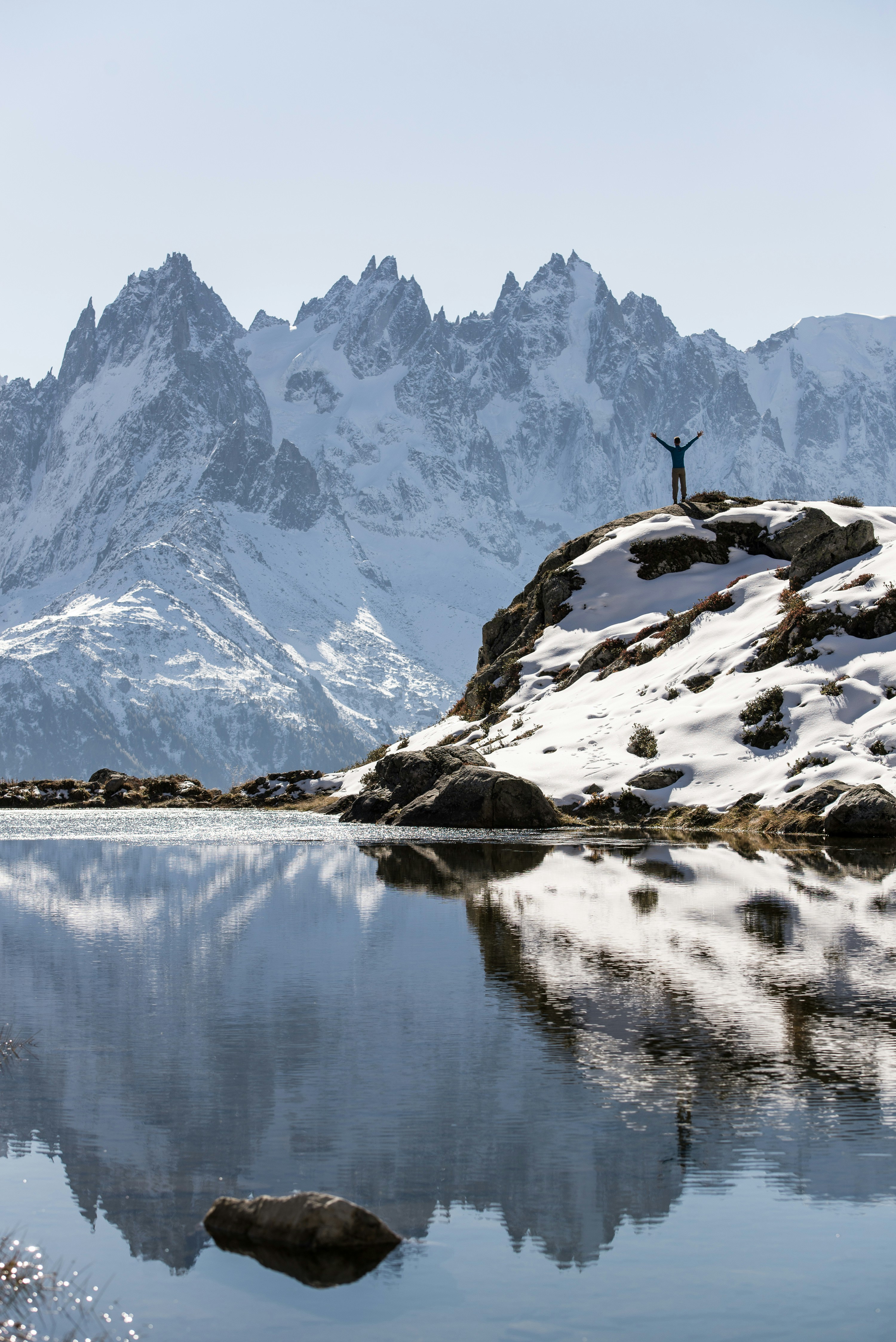 white and brown mountains near lake during daytime