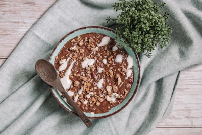 brown wooden spoon on white textile