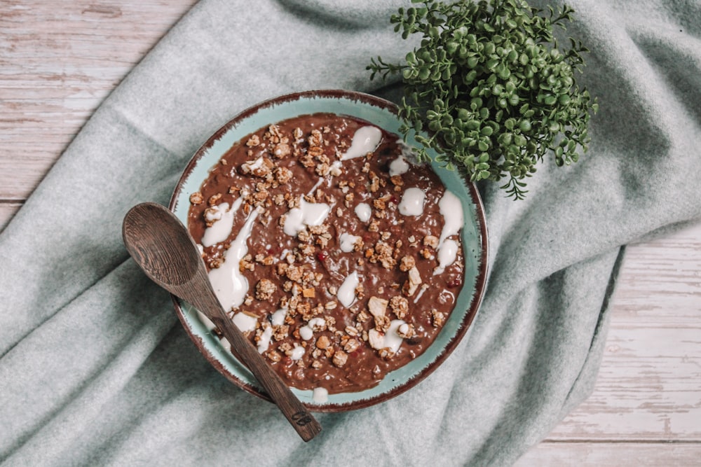 brown wooden spoon on white textile