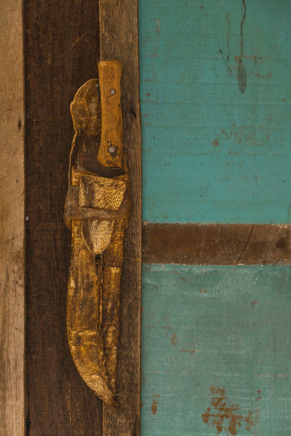 brown wooden door with gold door lever