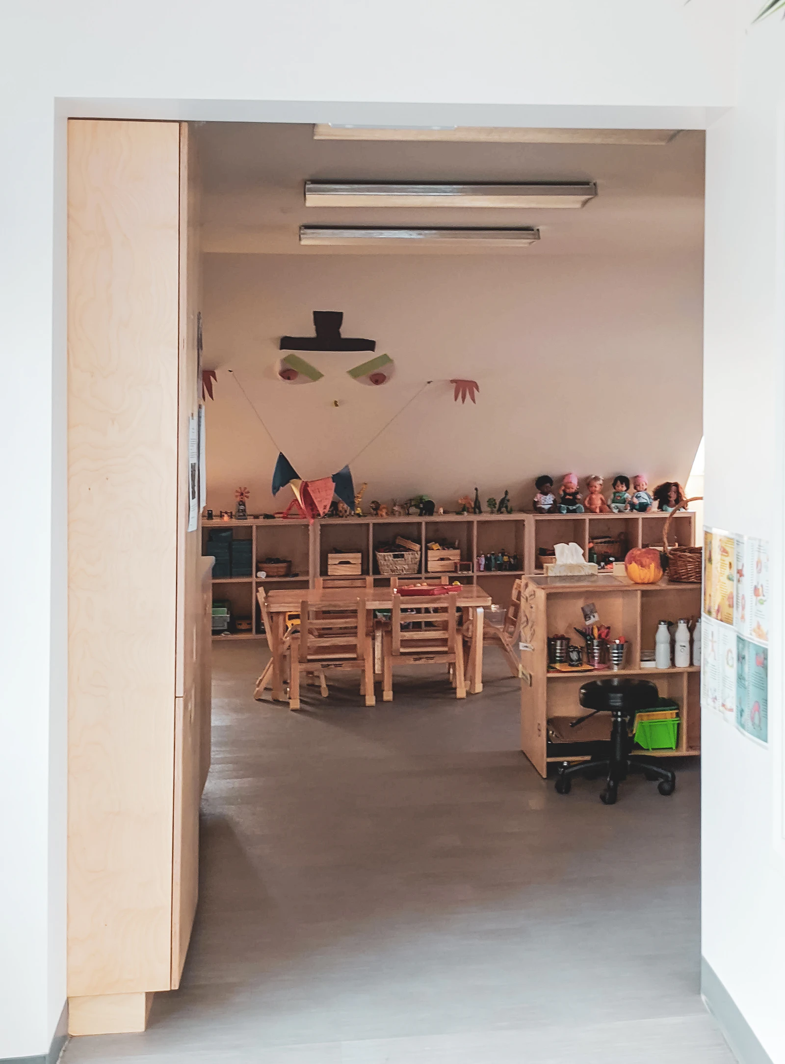 Preschool classroom with small chairs and tables