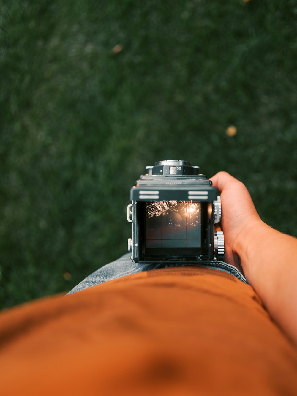 person holding black dslr camera