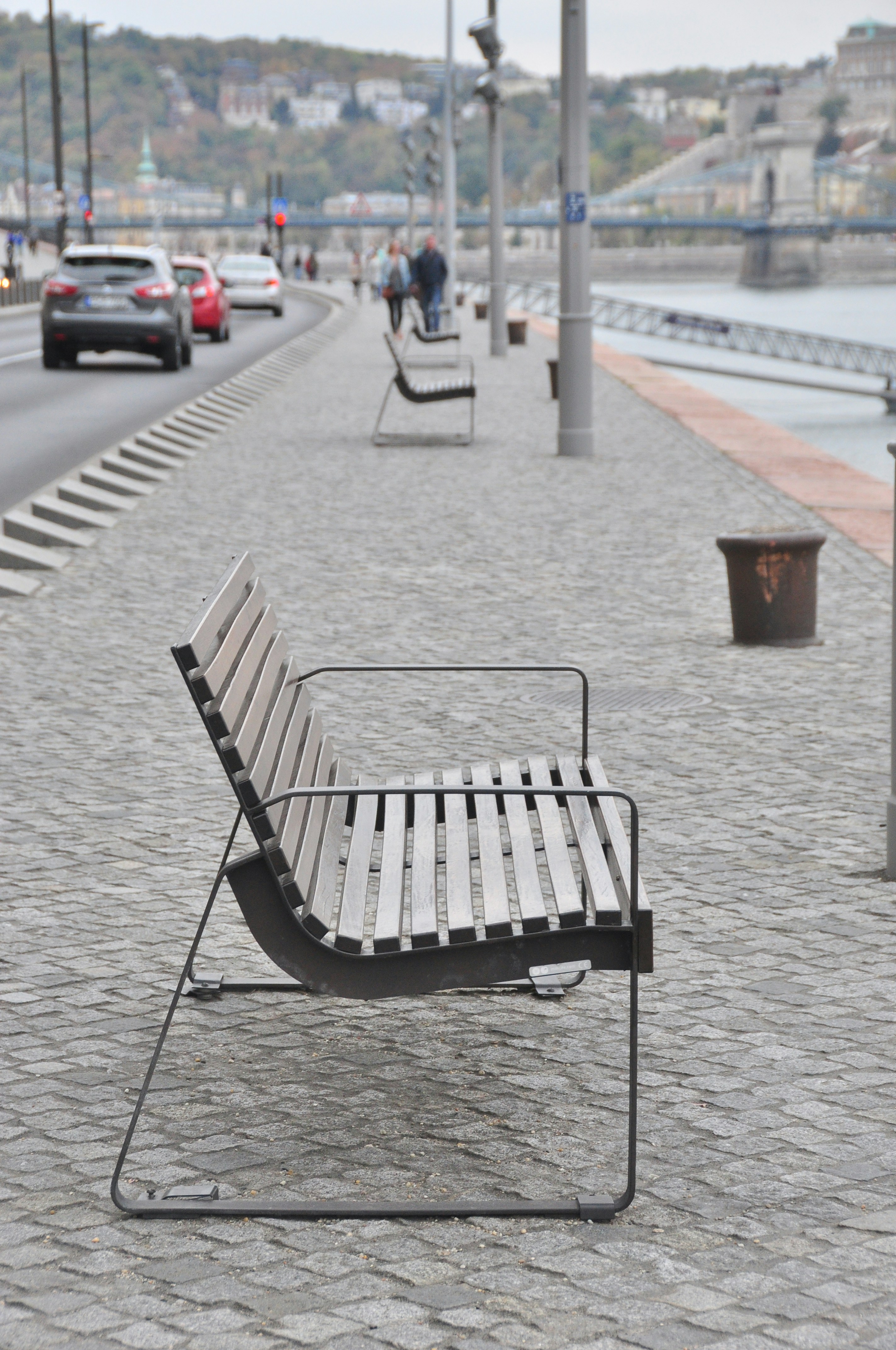 black metal bench on gray concrete floor