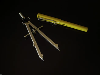 yellow and silver metal tool
