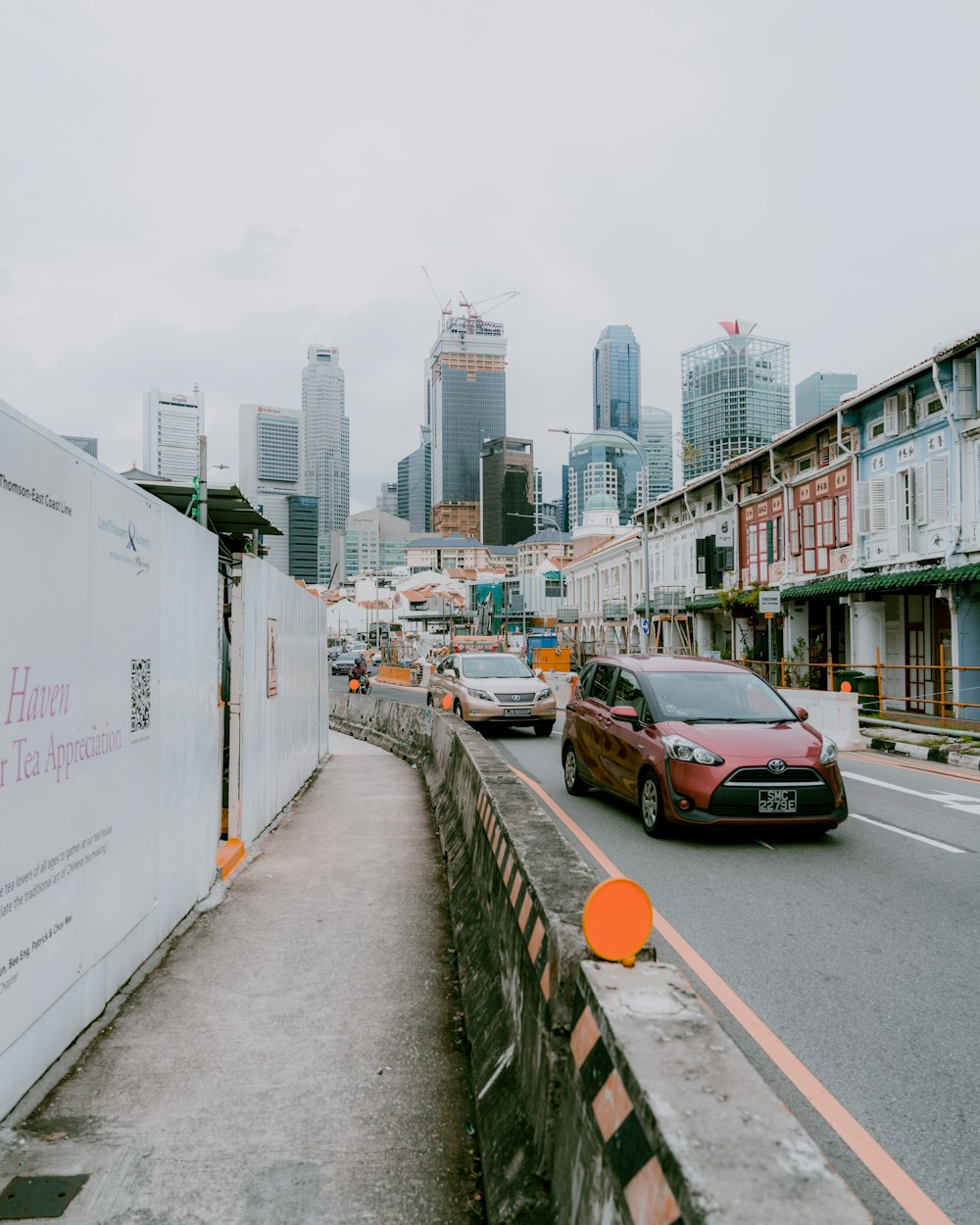 cars on road near buildings during daytime