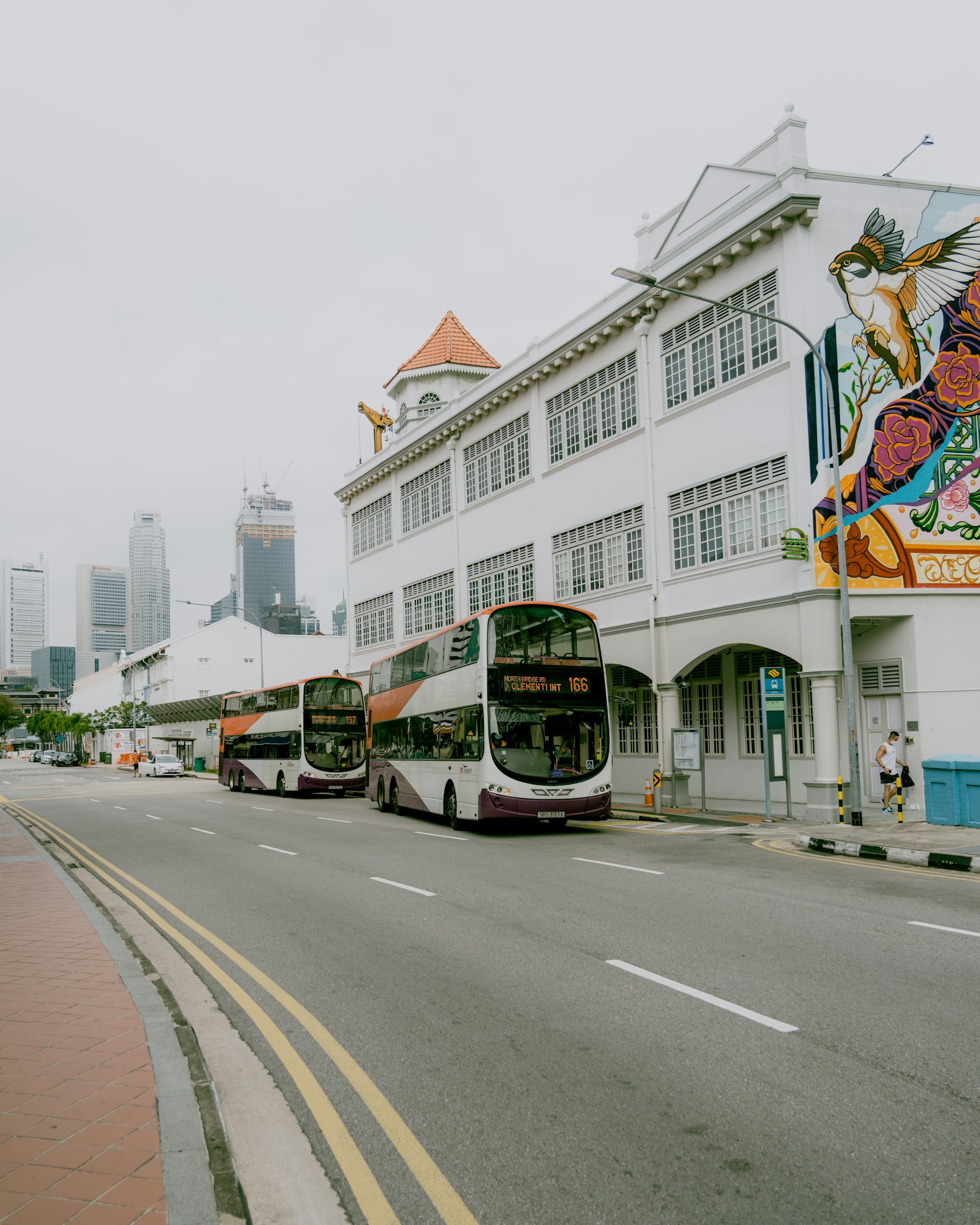 2 singapore sbs double decker buses on the road