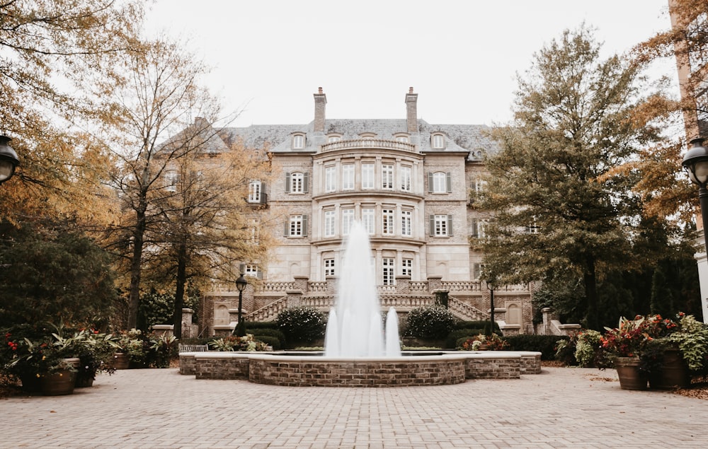 water fountain in front of brown concrete building