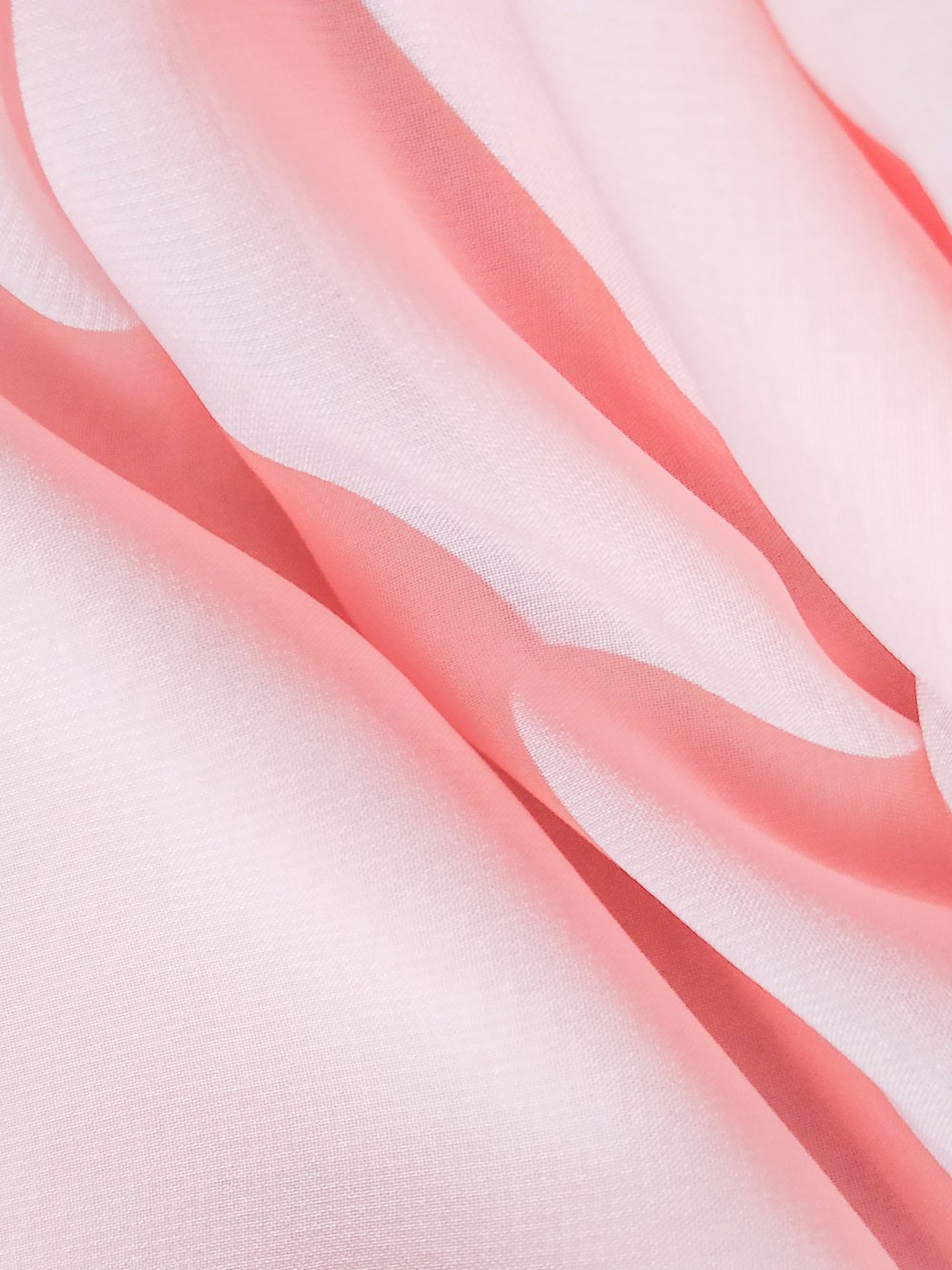 pink textile in close up photography