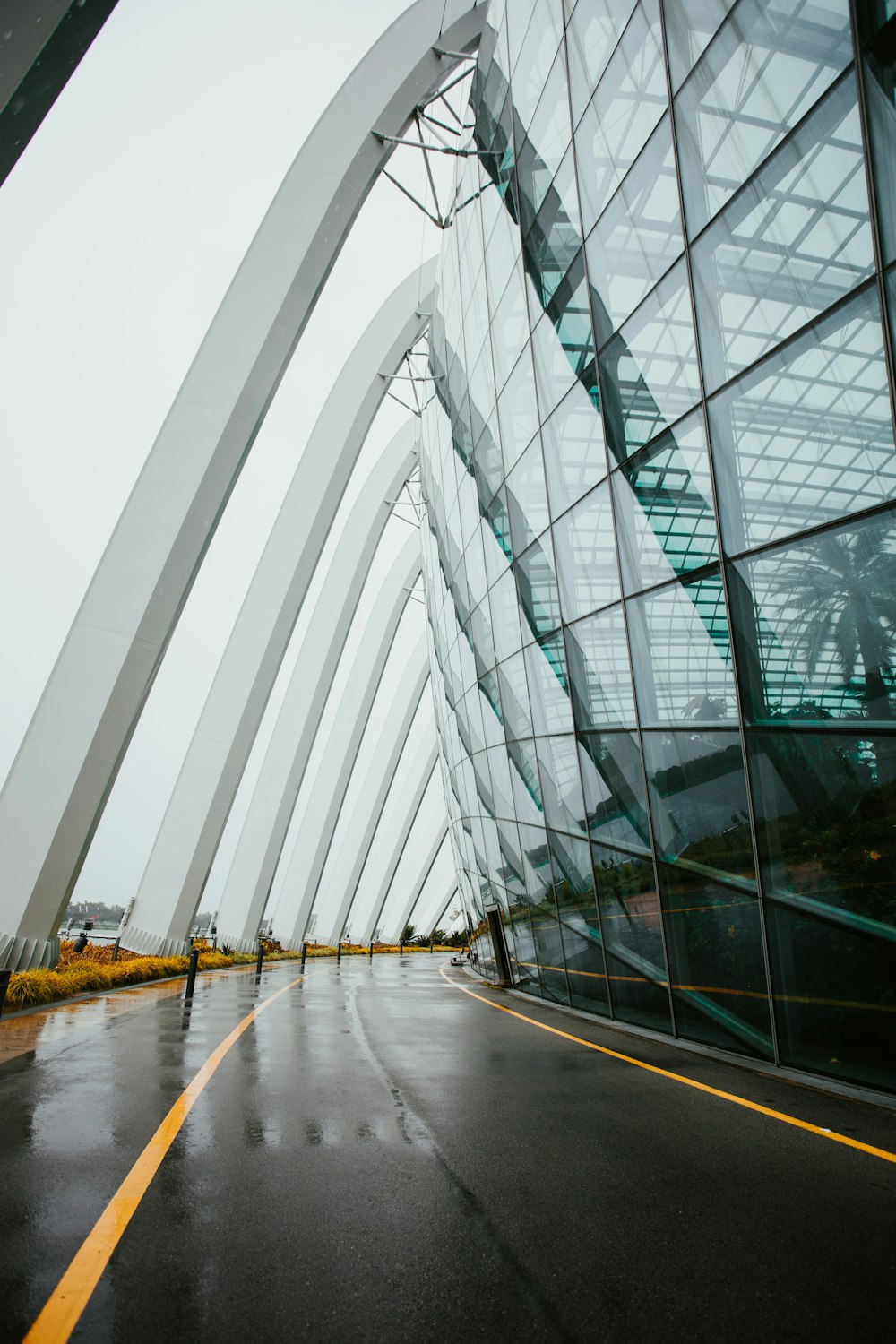 clear glass building near body of water during daytime