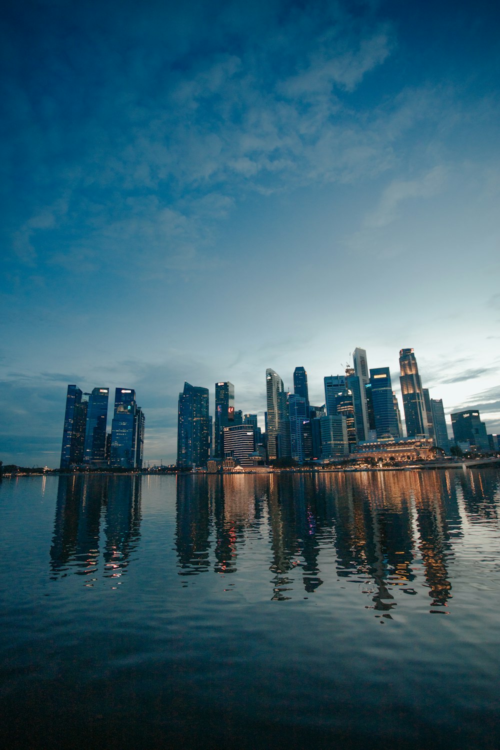 city skyline across body of water during daytime