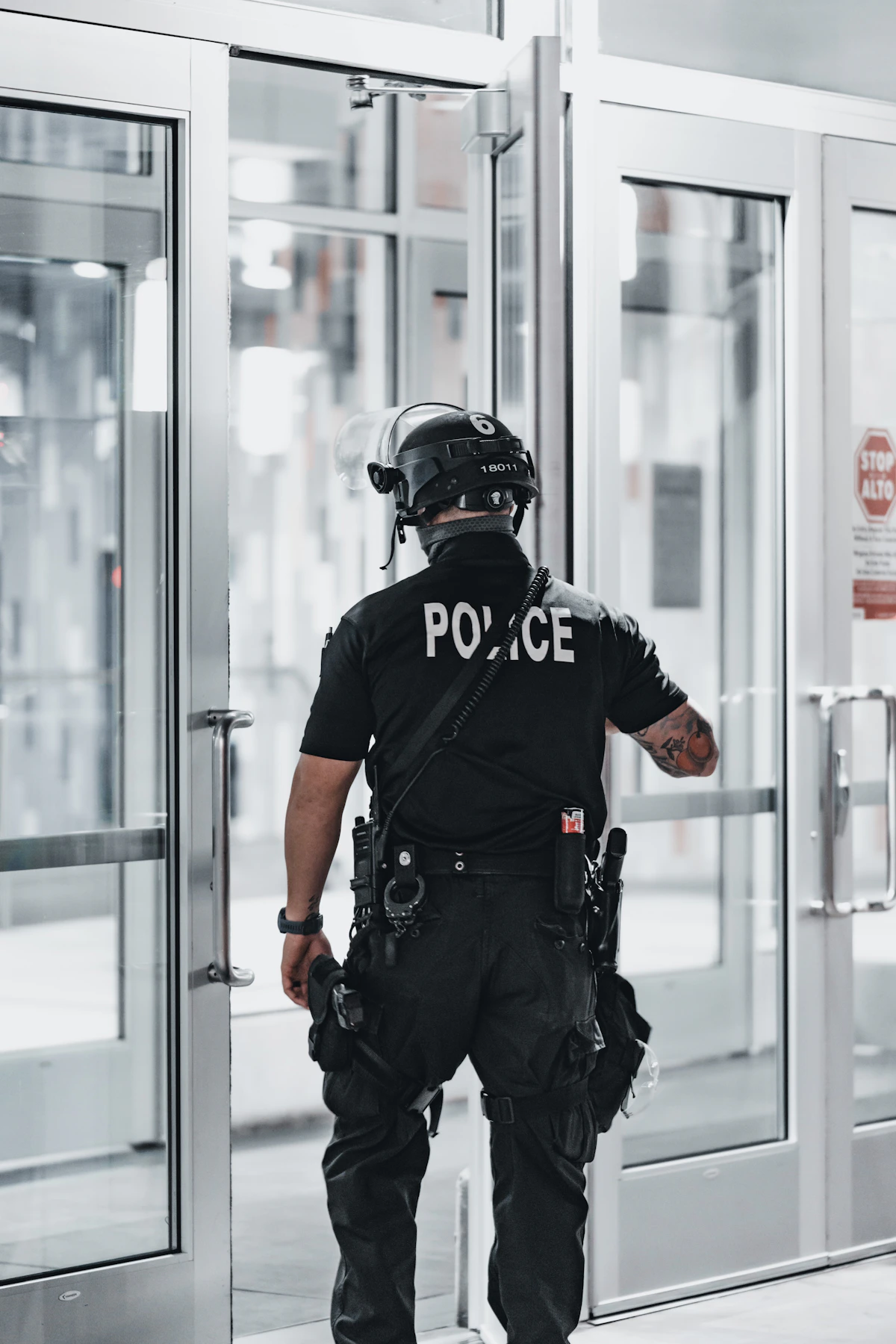 A police officer seen from behind, off duty and steady