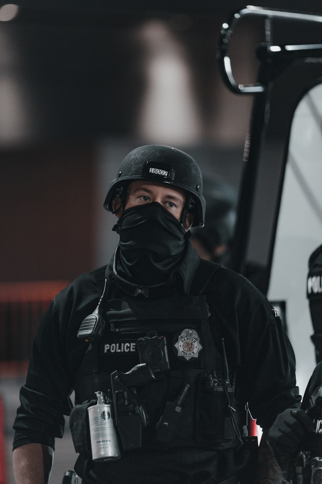 man in black and white jacket wearing black helmet