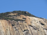 brown rocky mountain under blue sky during daytime