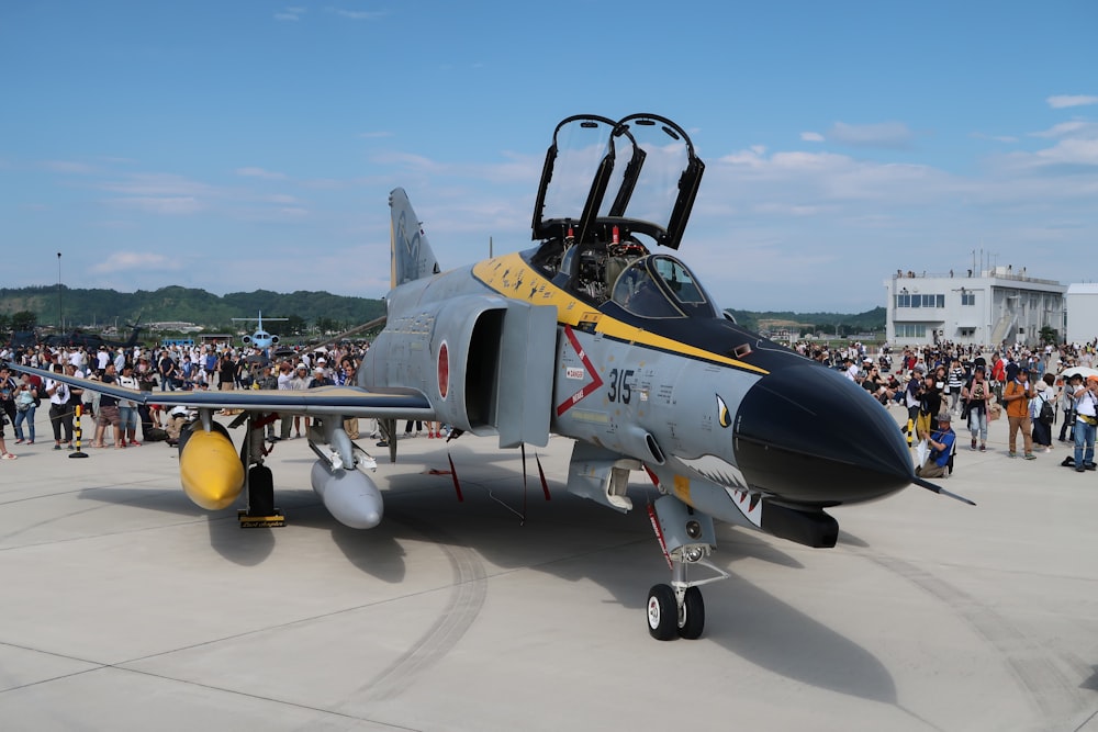 black and yellow fighter plane on white floor