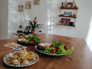 Warm, inviting shot of a Scandinavian-style restaurant table set with fresh artisanal dishes under soft natural light.