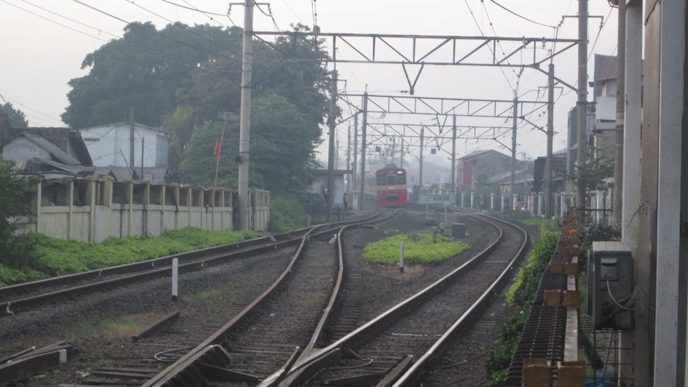 red and white train on rail tracks