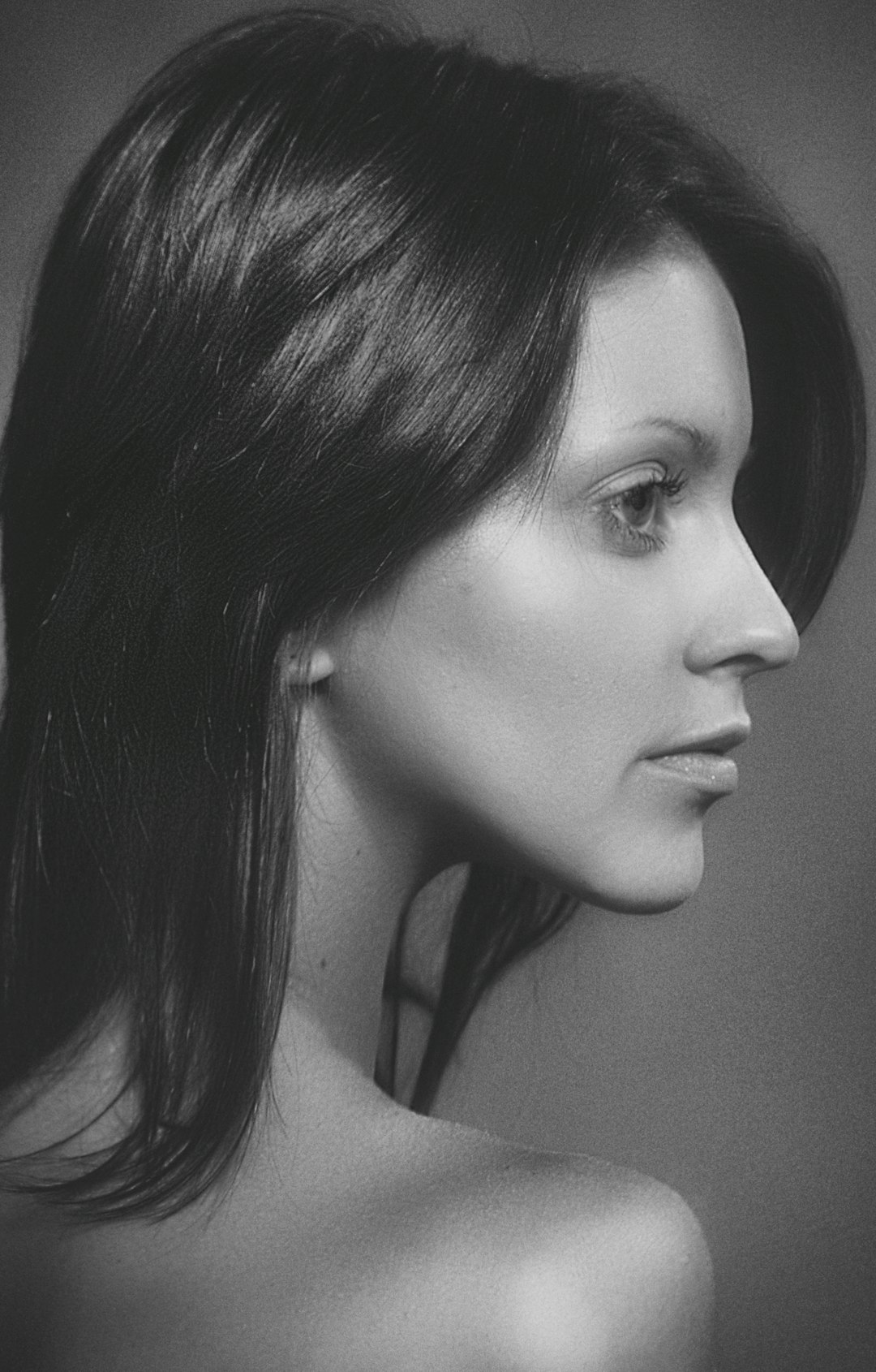 grayscale photo of womans face