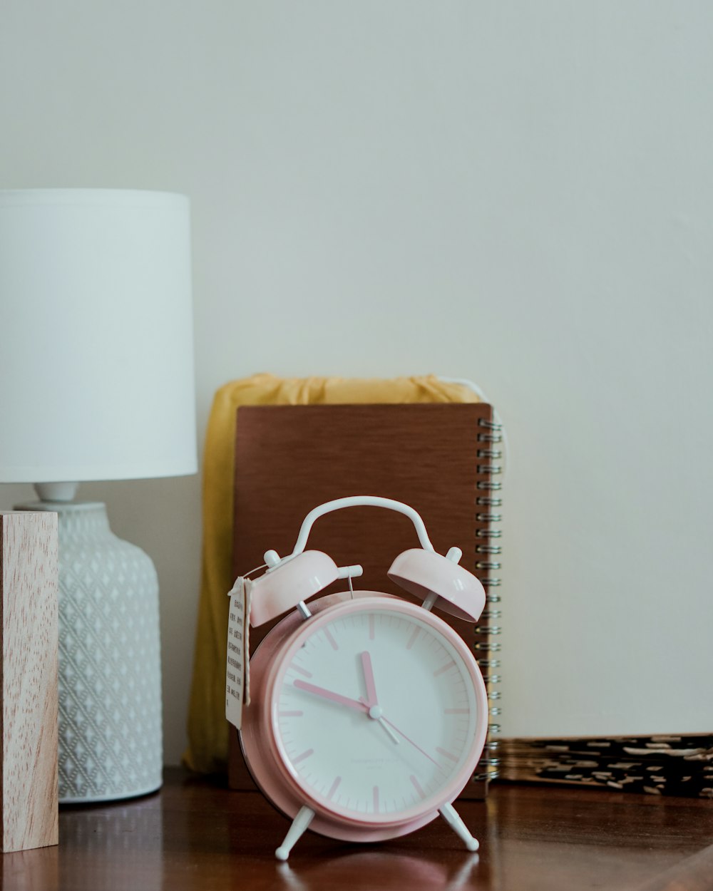 white and brown table lamp on brown wooden table