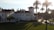 A well-maintained luxury vacation home exterior with elegant landscaping under soft sunlight.